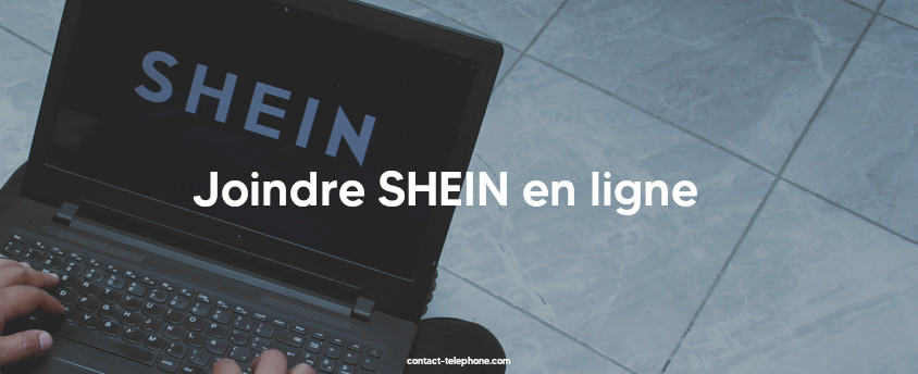 Main d'une personne tapant sur le clavier d'un ordinateur portable affichant le logo de SHEIN sur l'écran.