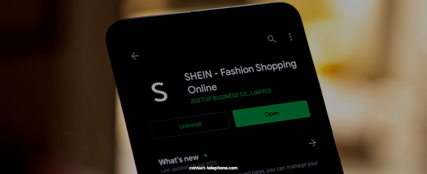 Téléphone affichant la page de téléchargement de l'application SHEIN.